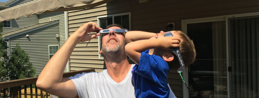 David and his son observing the solar eclipse