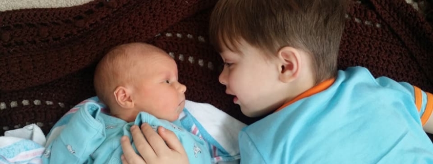 Brian talking to his new sister