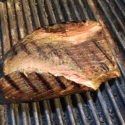 Flank steak searing on the grill