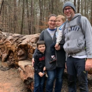In front of the log art at Umstead Park